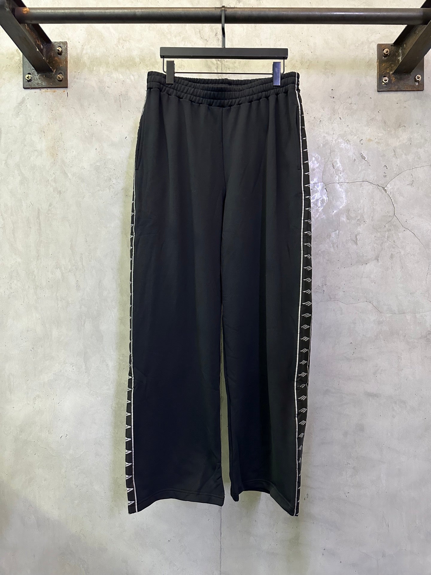 Balenciaga black pants with elastic waistband and side striped trim