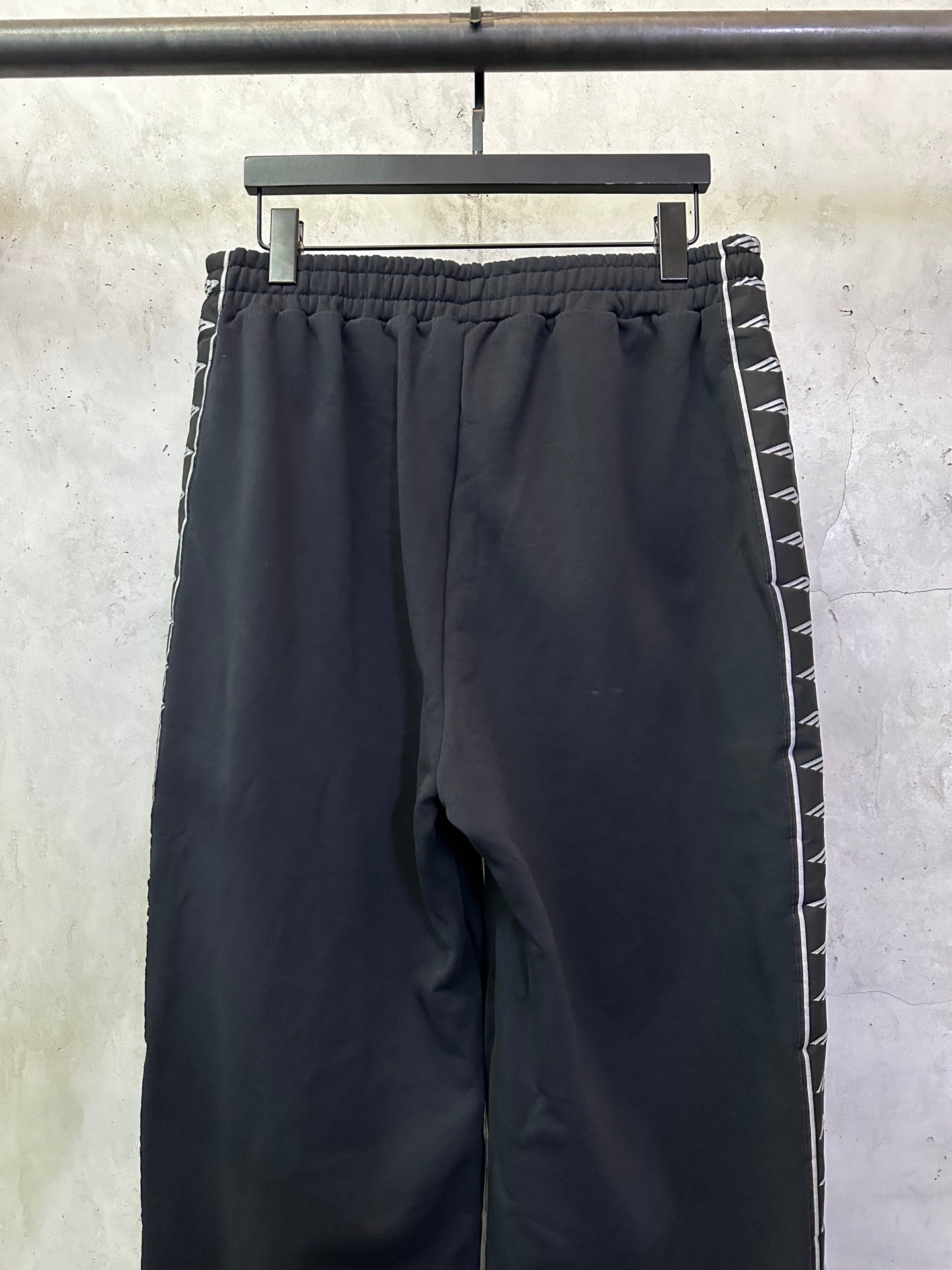 Navy track pants with elastic waistband and side stripe trim