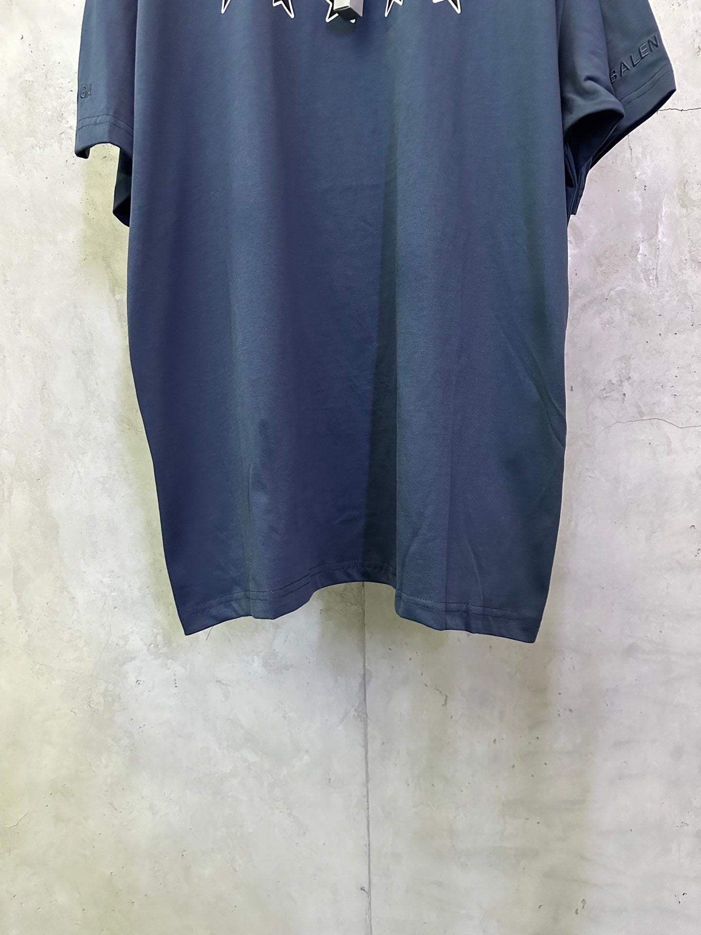 Balenciaga dark blue crewneck T-shirt with visible hem and short sleeves