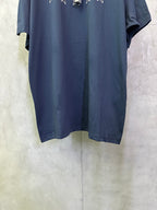 Dark blue short-sleeve T-shirt showing curved hem and side drape