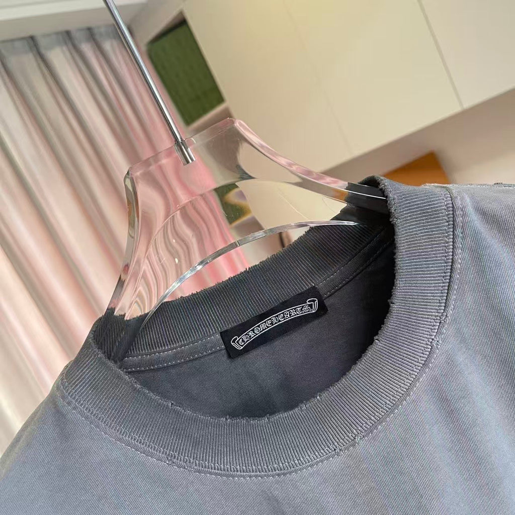 Crew-neck gray T-shirt with black brand label at neckline and short ribbed collar