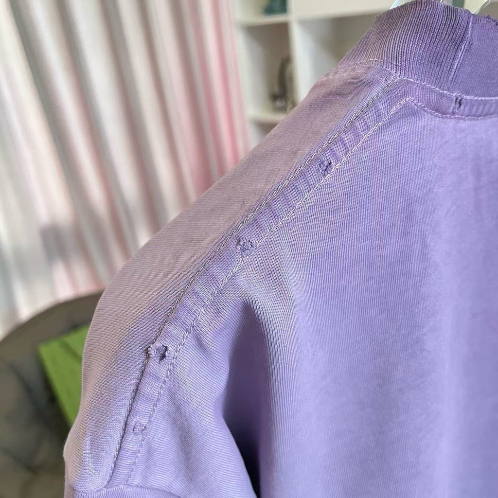 Lavender T-shirt shoulder and sleeve hem with stitched fabric texture