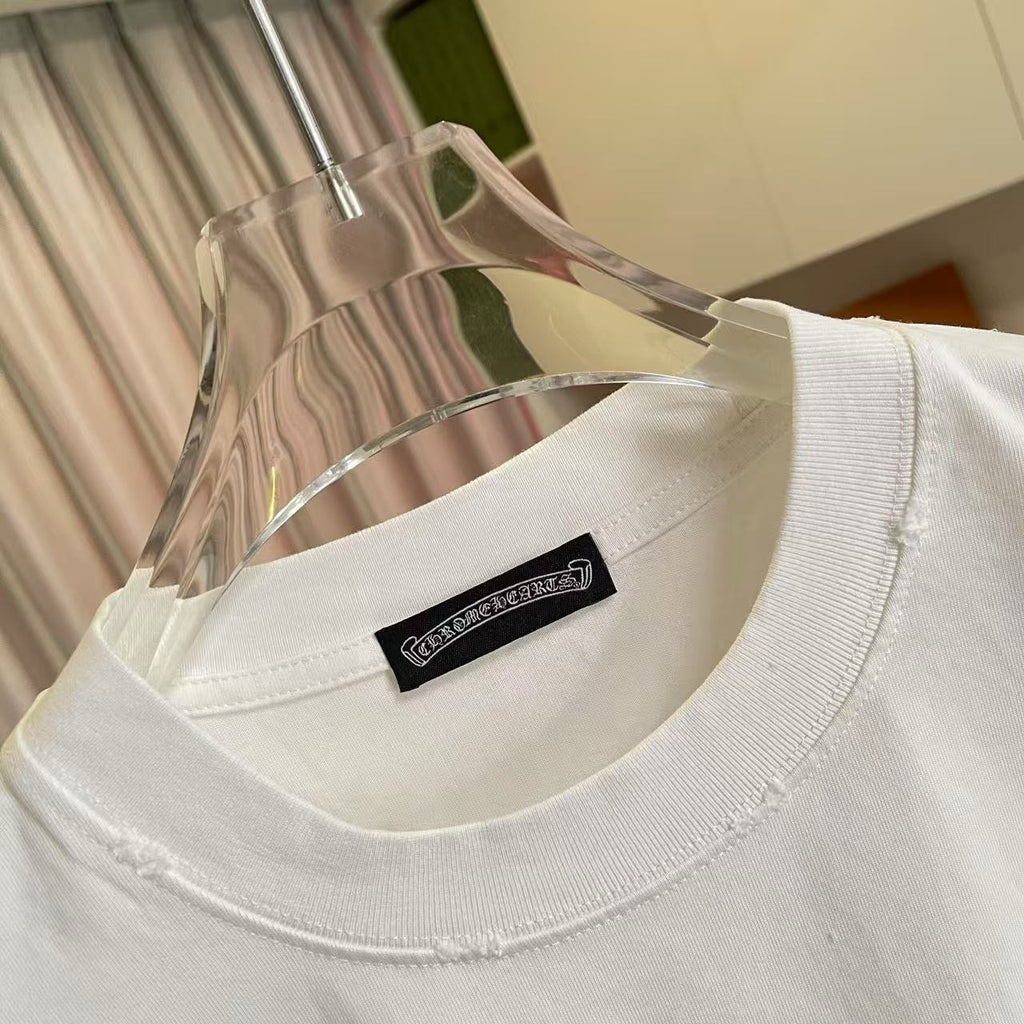 White crewneck T-shirt with black brand patch label at the neckline