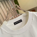 White crewneck T-shirt with black brand patch label at the neckline