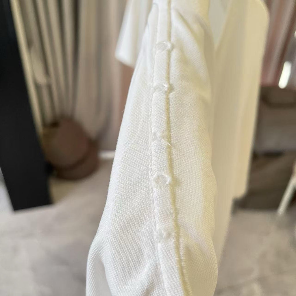 White T-shirt sleeve hem with stitched cuff detail