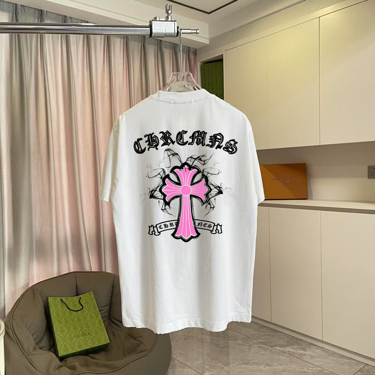 White short-sleeve T-shirt with large back pink cross graphic