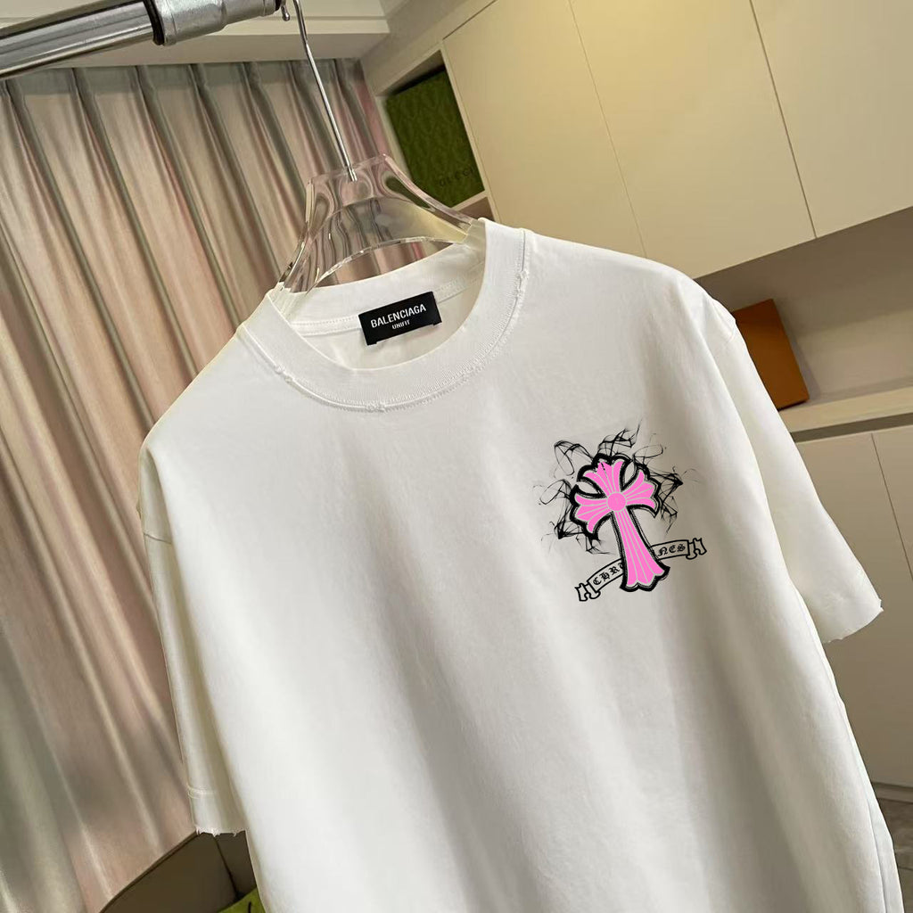 White T-shirt with large pink and black cross graphic print on the chest