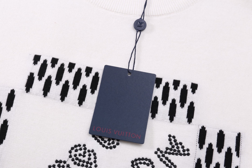 Louis Vuitton white T-shirt with black patterned design and hanging tag