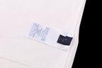White T-shirt inside care label and size tag near side seam
