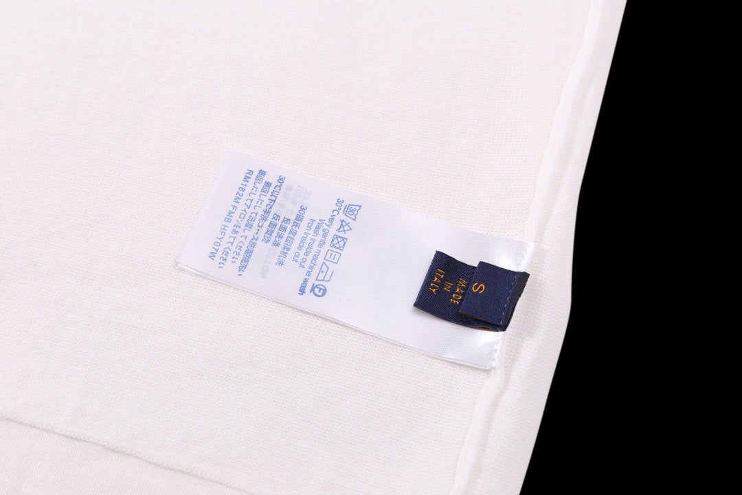 White T-shirt inside care label and size tag near side seam
