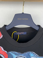 Louis Vuitton black crewneck T-shirt with blue interior label at neckline
