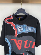 Louis Vuitton graphic T-shirt with black base, blue wave, and red lettering print