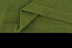 Green T-shirt folded hem with visible side seam stitching