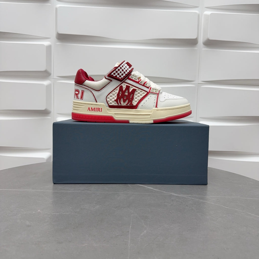 Amiri low-top sneakers with white leather, red accents, and check strap