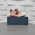 Amiri low-top sneakers with white leather, red accents, and check strap