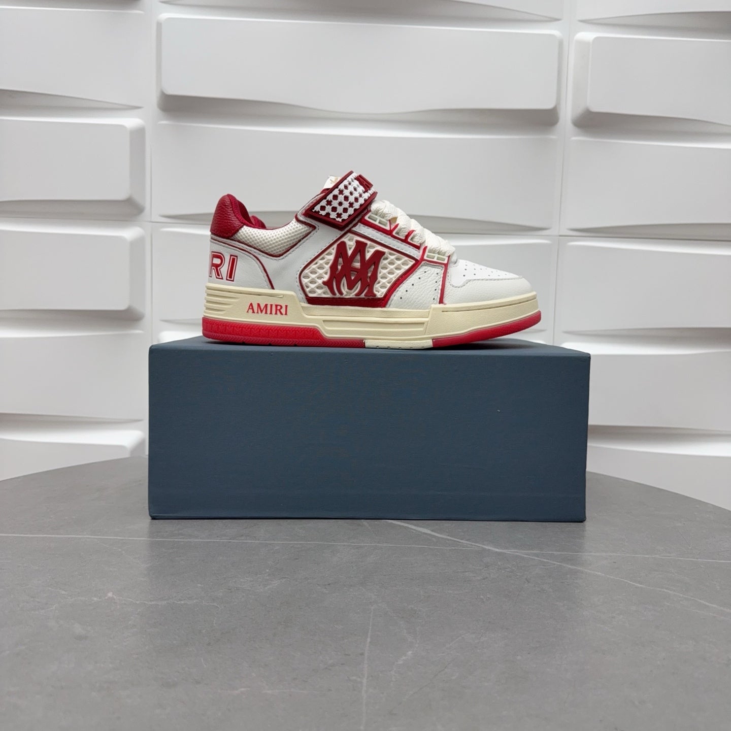 Amiri low-top sneakers with white leather, red accents, and check strap