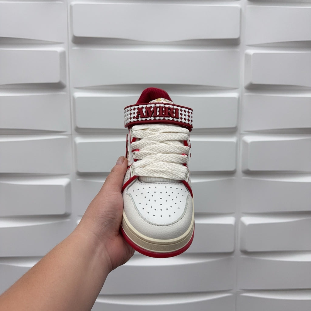 Amiri sneaker sole and heel view, white leather with red lining and “AMIRI”