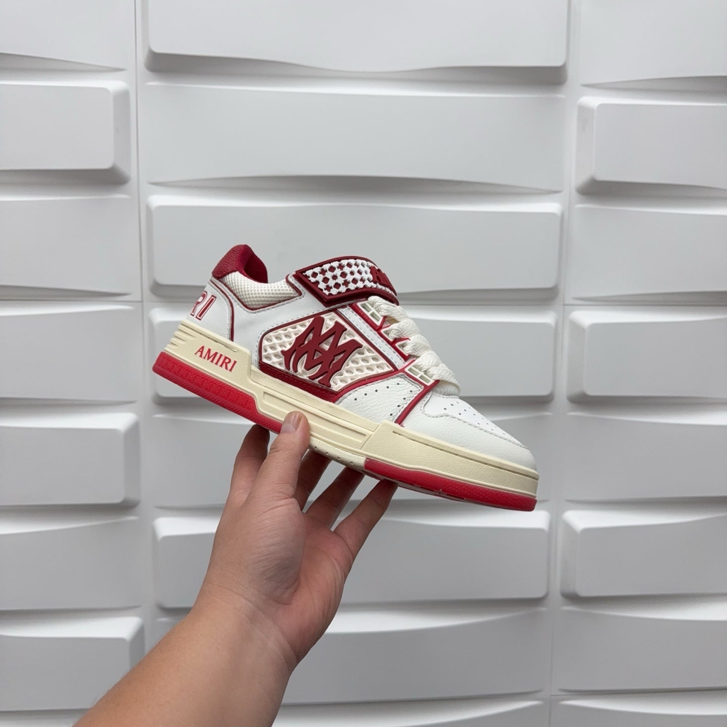 Amiri low-top sneakers side view, white leather with red accents and check strap