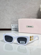 White oversized sunglasses with dark tinted lenses and gold logo temple detail