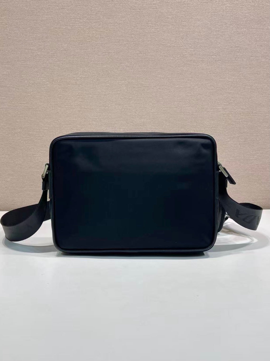 Prada crossbody bag with smooth front and side straps, dark blue