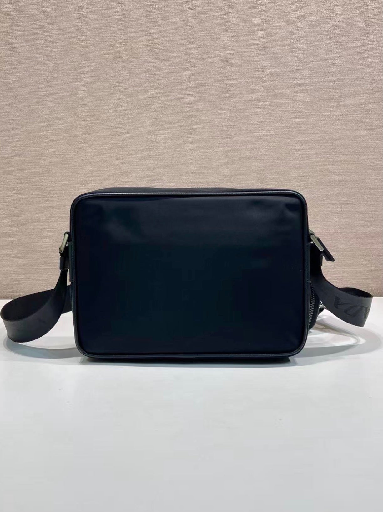 Prada crossbody bag with smooth front and side straps, dark blue