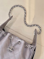 Quilted leather shoulder bag with chain handles and Chanel CC charm, silver tone open top