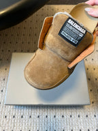 Tan suede Balenciaga slide sandal with black tongue logo label