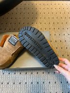 Tan suede Balenciaga sandals with black rubber outsole and deep tread