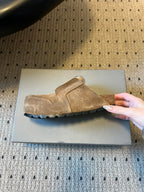 Tan suede Balenciaga clog-style sandals, single side view, black sole edge