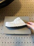 Balenciaga white slide sandals with side opening and black sole detail
