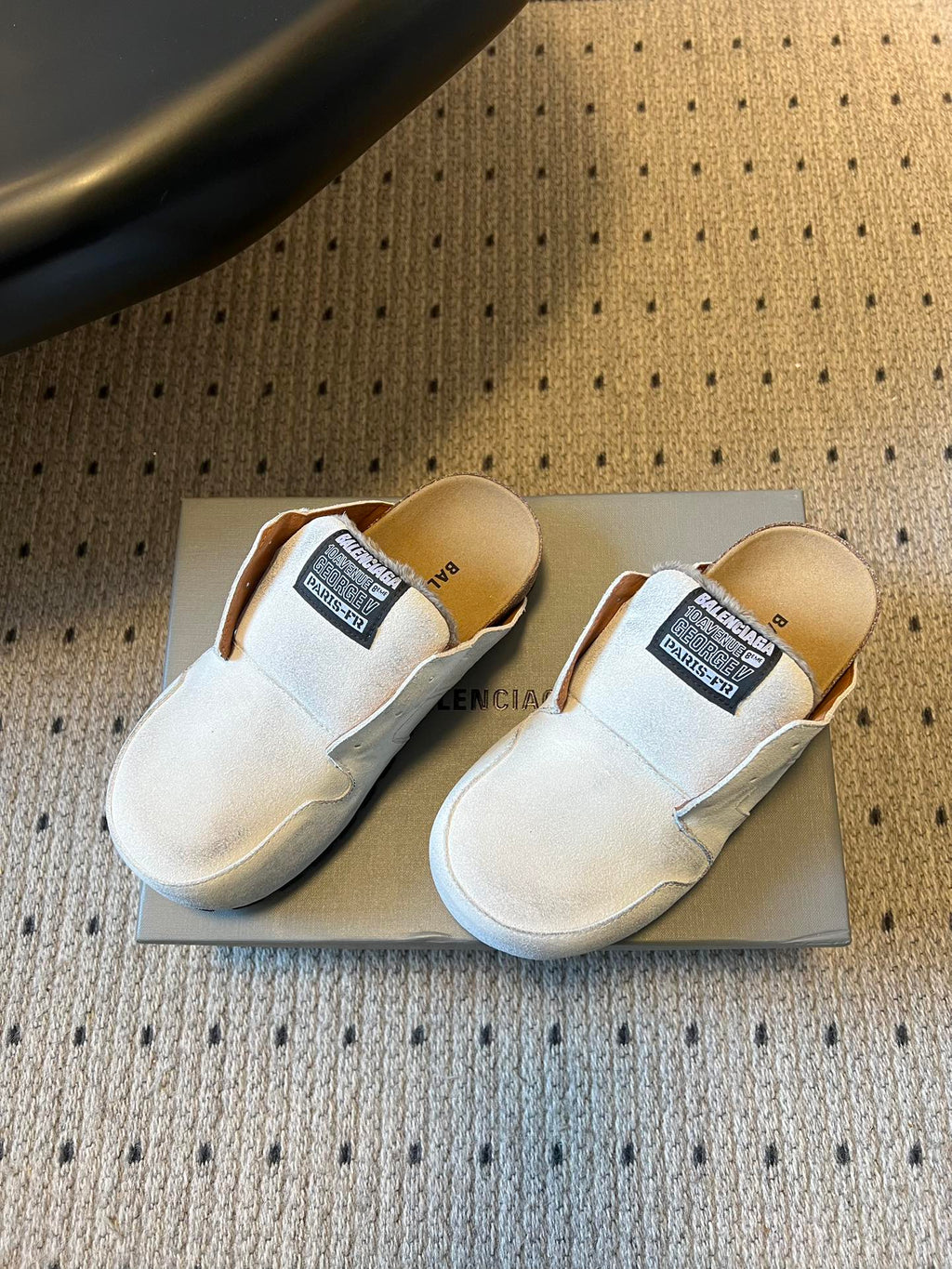 Balenciaga white slide sandals, side view, with black logo label