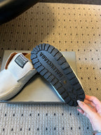 Balenciaga slide sandals outsole with textured tread, shown from below
