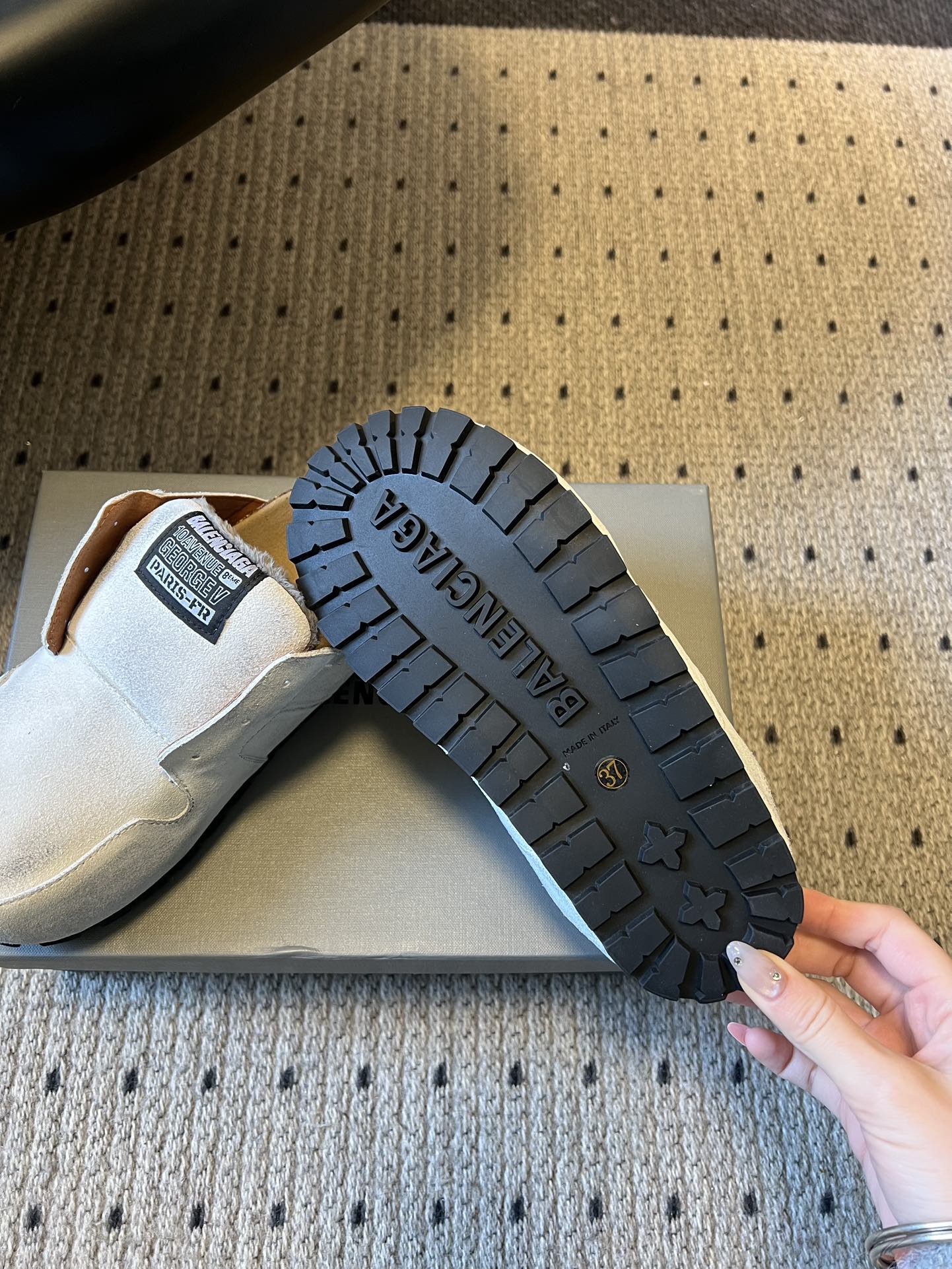 Balenciaga slide sandals outsole with textured tread, shown from below