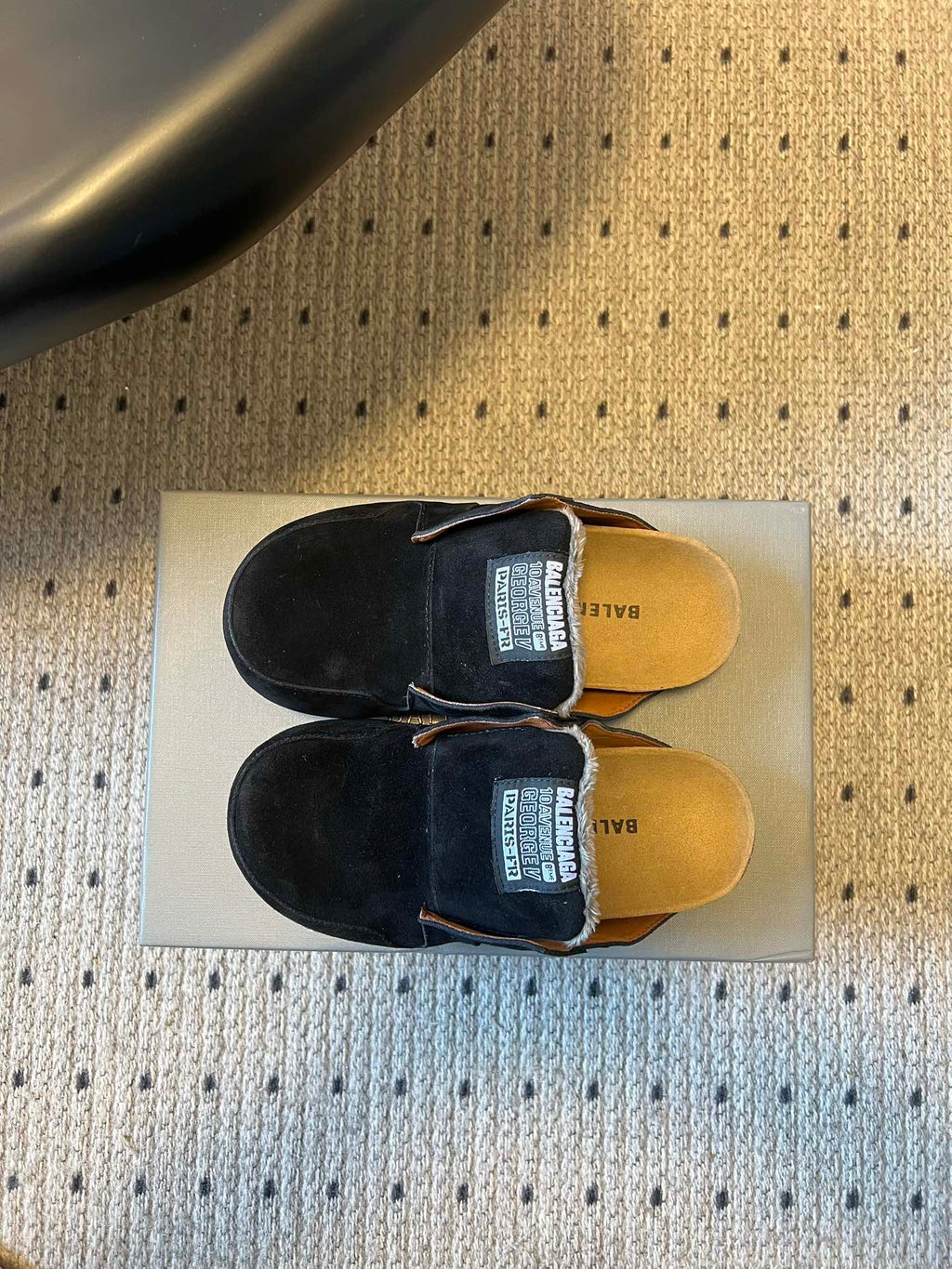 Black suede slide sandals, top view with Balenciaga logo on footbed