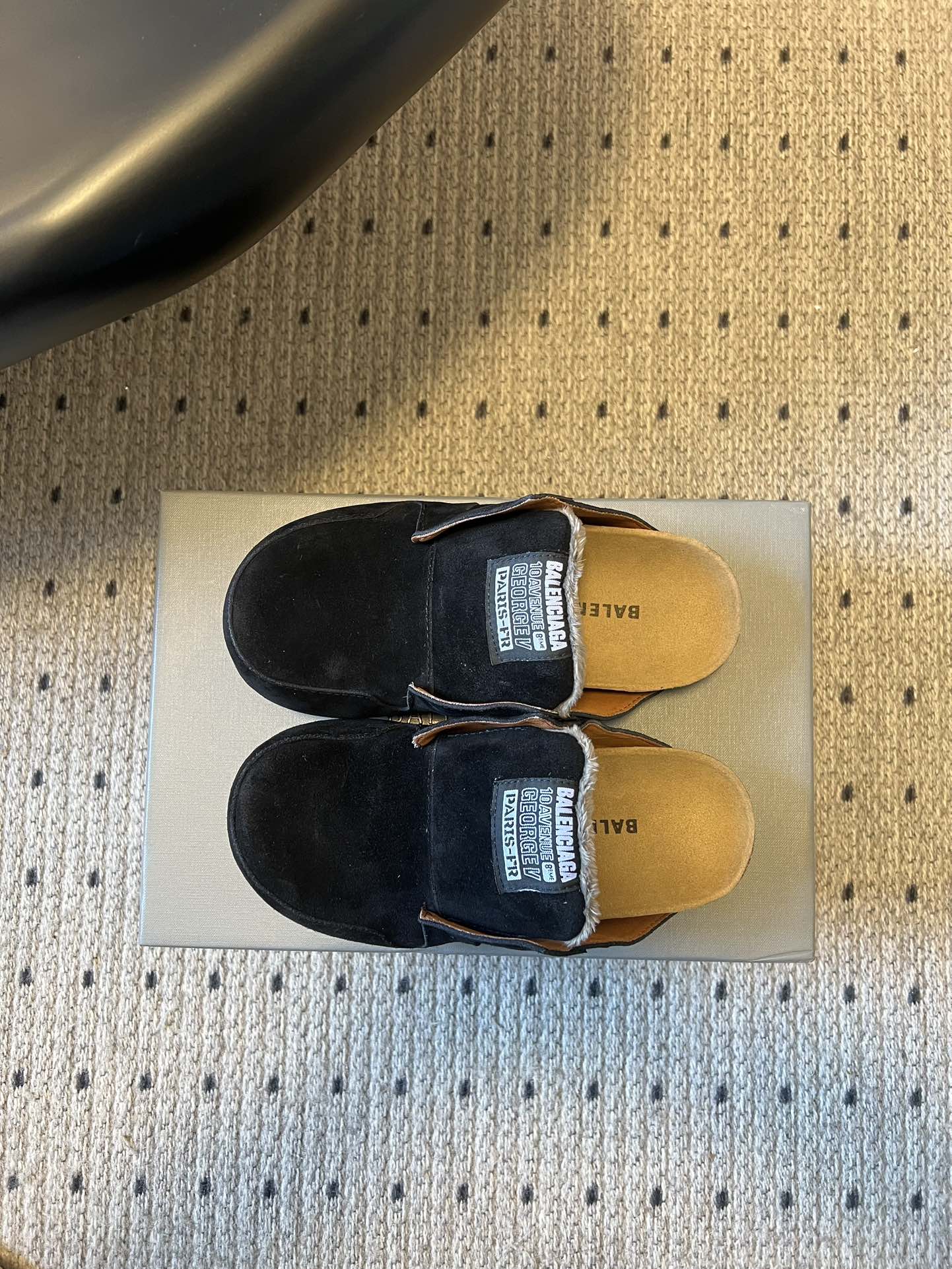 Black suede slide sandals, top view with Balenciaga logo on footbed