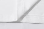 Off-white T-shirt fabric closeup with stitched collar detail