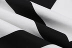 Close-up of white fabric with black diagonal graphic print on an Off-White T-shirt