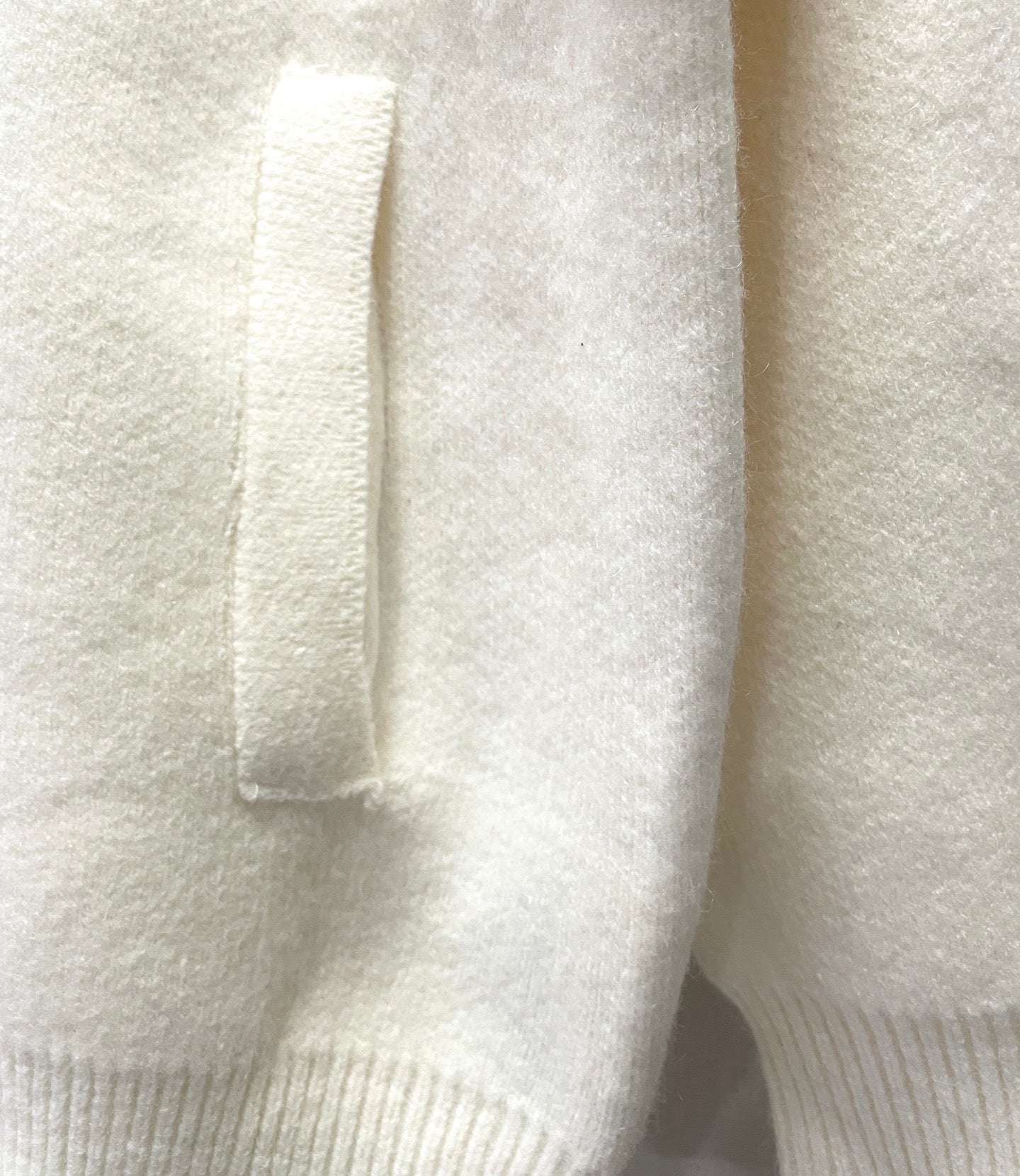 White hoodie front fabric with zip and ribbed cuff detail