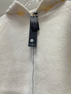 White hoodie zipper and hood close-up with hanging Stone Island tag