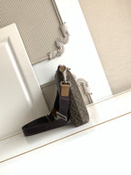Fendi bag with crossbody strap, monogram body, and top zip closure