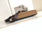 Monogram crossbody bag with tan trim and adjustable strap