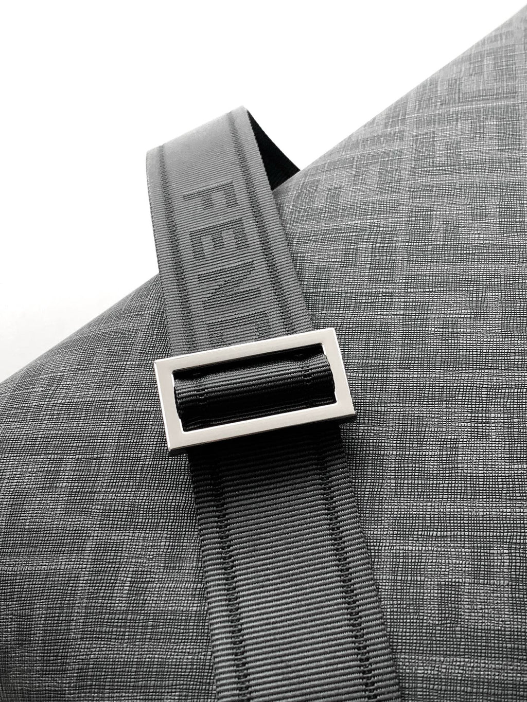 Fendi strap detail with FENDI lettering on dark gray fabric