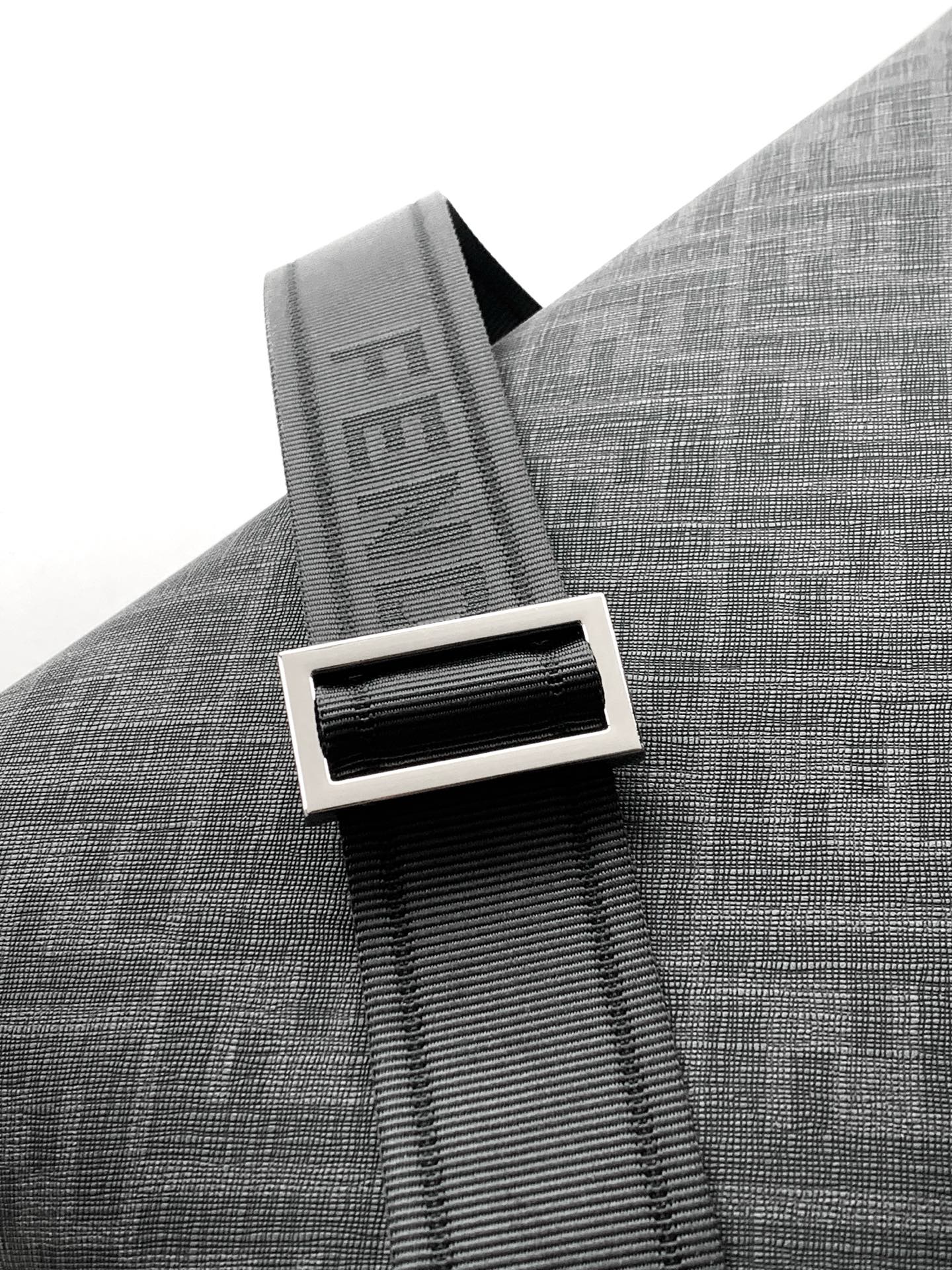 Fendi strap detail with FENDI lettering on dark gray fabric