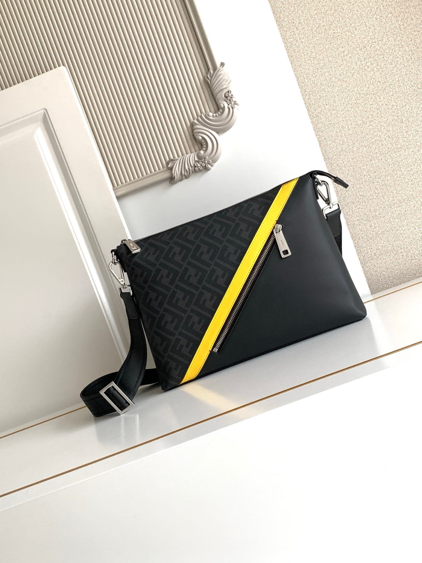 Fendi bag with dark logo canvas, yellow edge stripe, zip top, crossbody strap