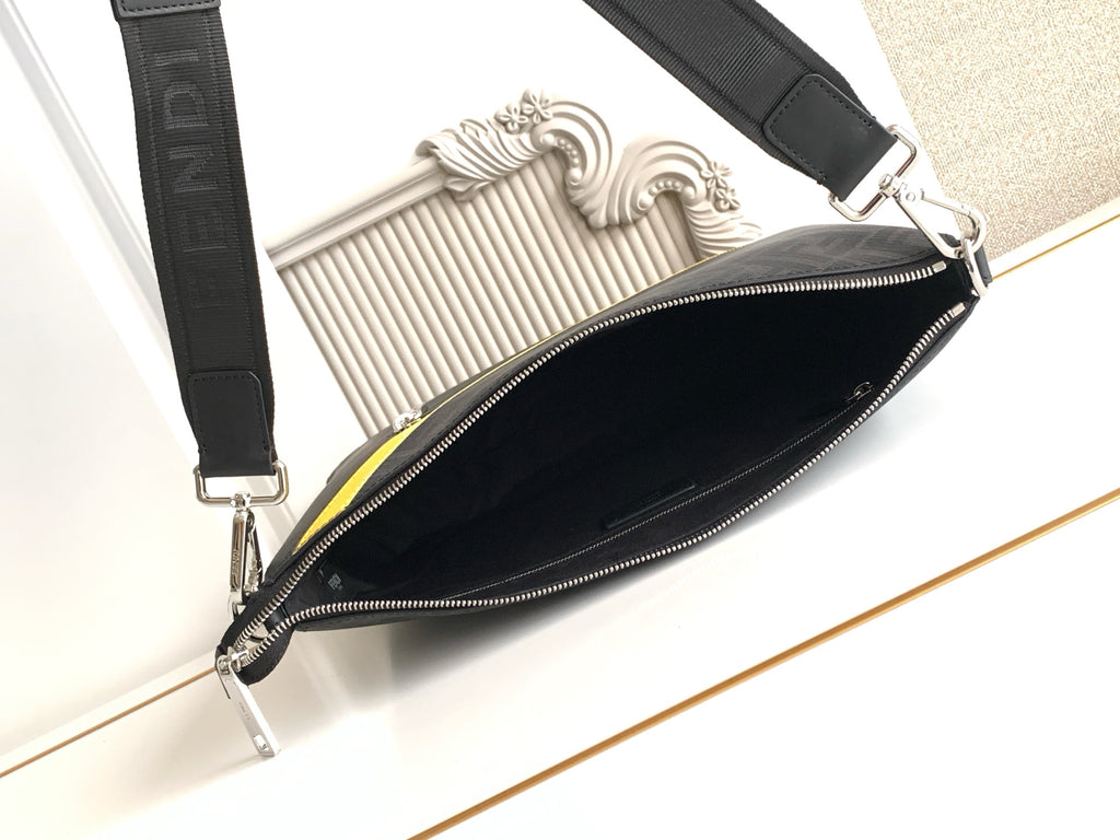 Fendi bag with silver zipper, dark logo body, and yellow-trim interior edge