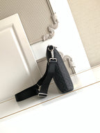 Fendi bag in dark logo fabric with adjustable shoulder strap and silver hardware