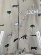 Beige Louis Vuitton jacket front detail with animal and palm embroidery and button placket