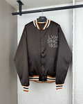 Long-sleeve bomber jacket with snap buttons and striped ribbed trim at cuffs and hem