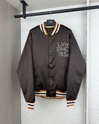 Long-sleeve bomber jacket with snap buttons and striped ribbed trim at cuffs and hem