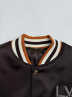 Bomber jacket collar with striped ribbing and snap button placket